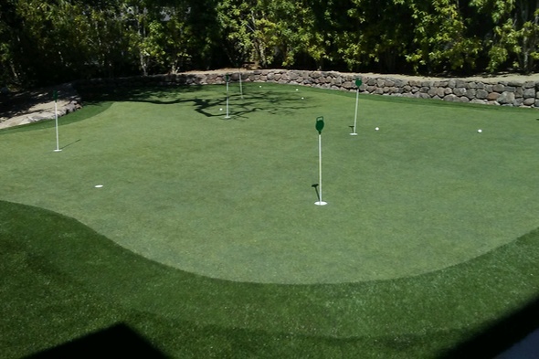 San Francisco backyard putting green with flags and trees